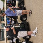 Fred Antczak and Donovan Anderson near golf carts
